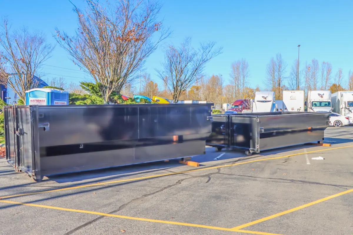 Professional dumpster rental service with roll-off container on residential driveway in Hialeah Gardens